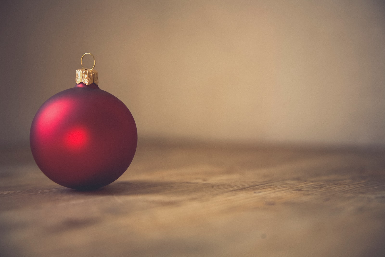 closeup photo of red ball ornament on surface