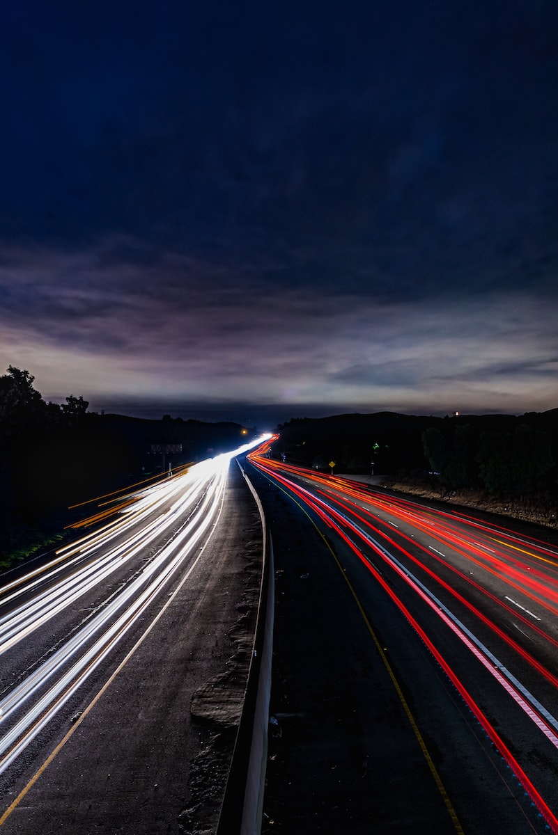 car lights on road on time lapse photographt