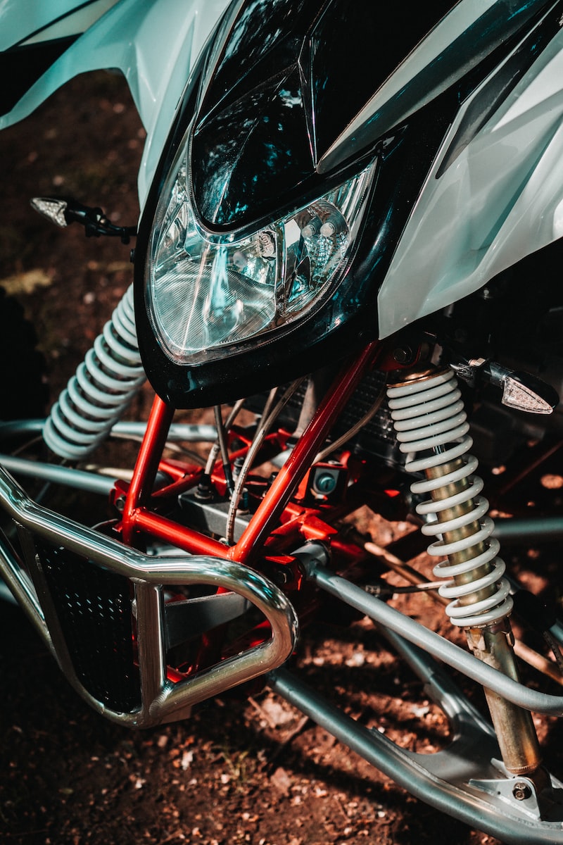 black and red motorcycle in close up photography